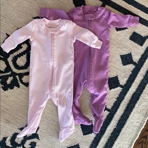 Two cotton onesies in light pink and purple